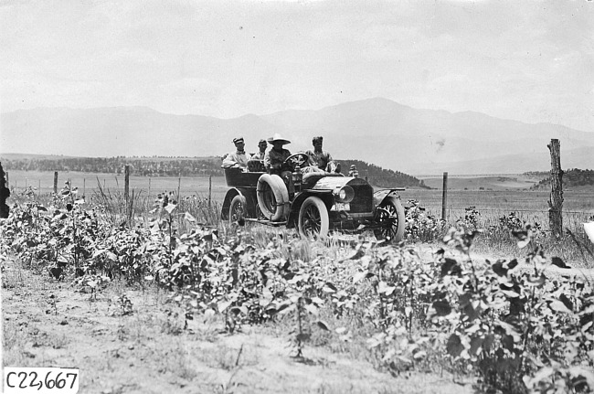 Glidden tourists on rural road in Colo., at 1909 Glidden Tour