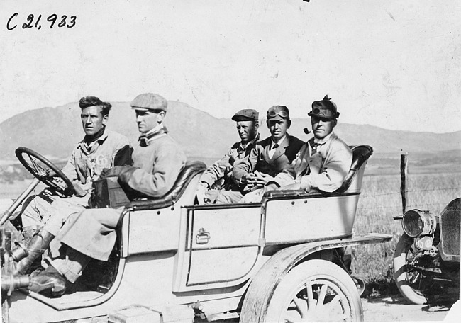 Harry Bill and crew pose in Chalmers car in Colo., at 1909 Glidden Tour