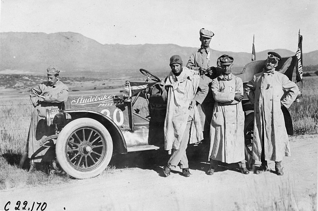 Dan McIntosh and crew pose with Studebaker press car on rural road in Colo., at 1909 Glidden Tour