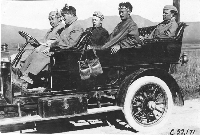 Harry McIntosh and crew pose in Studebaker press car on rural road in Colo., at 1909 Glidden Tour