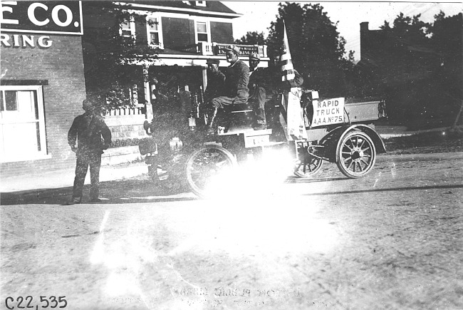 Rapid motor truck parked in front of building in Colo., at 1909 Glidden Tour