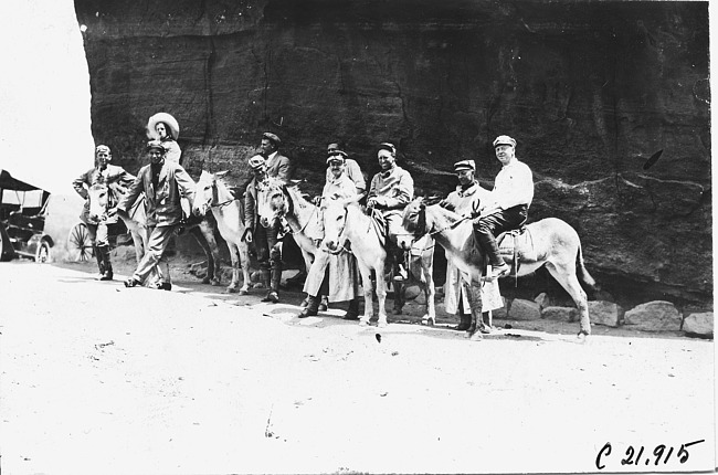Glidden tourists on donkeys in the Garden of the Gods, Colo., at the 1909 Glidden Tour