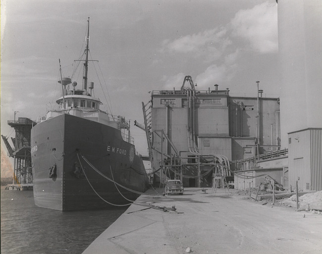 E.M. FORD of the Huron Portland Cement Company being Loaded