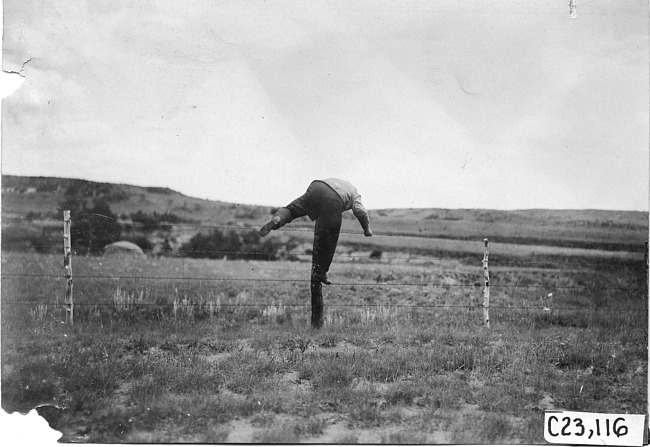 Smithson climbing fence at the 1909 Glidden Tour