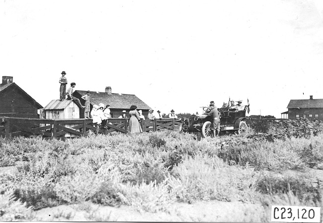 Glidden car stopped at farm, at the 1909 Glidden Tour