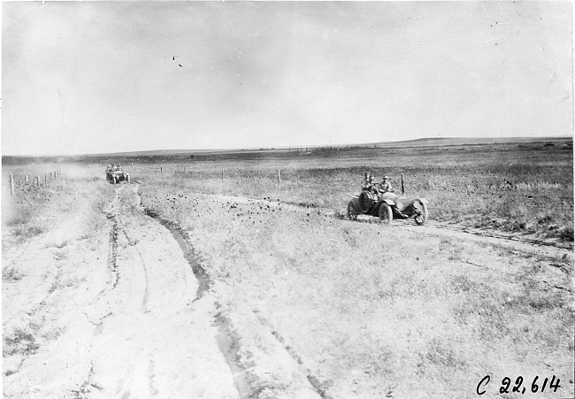 Glidden tourists on rural road in desolate area of Kansas, at 1909 Glidden Tour