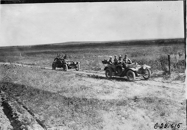 Glidden tourists on rural road in desolate area of Kansas, at 1909 Glidden Tour