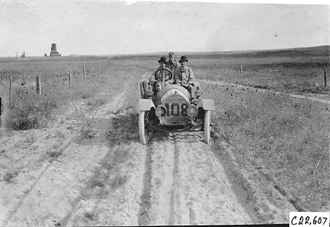 Glidden tourists in car #108 on sandy road in Kansas, at 1909 Glidden Tour