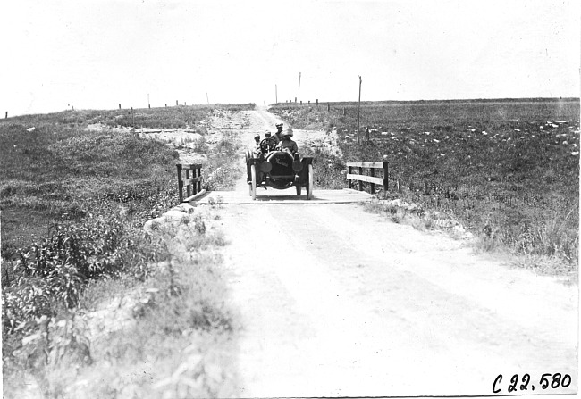 Moline car crossing wooden bridge near Bunker Hill, Kan., at 1909 Glidden Tour