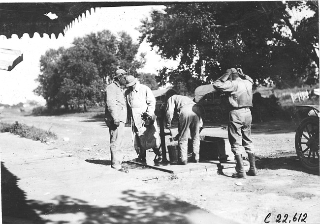 Crew of Moline car at water pump in Brookville, Kan., at 1909 Glidden Tour