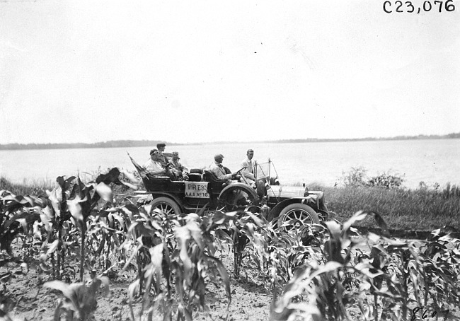 Thomas press car on rural road beside lake near Junction City, Kan., at 1909 Glidden Tour