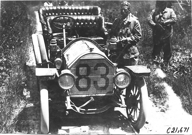 H. Bill with Chalmers press car on rural road near Junction City, Kan., at 1909 Glidden Tour