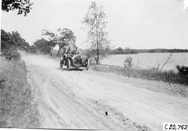 Glidden tourist car #12 on rural road next to lake near Junction City, Kan., at 1909 Glidden Tour