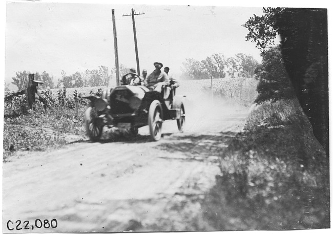 Gregory in Moline car on rural road near Junction City, Kan., at 1909 Glidden Tour