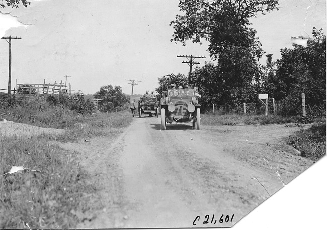 Thomas press car and Rapid motor truck on rural road near Junction City, Kan., at 1909 Glidden Tour