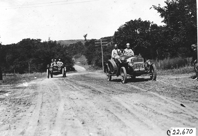 Glidden tourist car #107 and Moline car on rural road near Junction City, Kan., at 1909 Glidden Tour