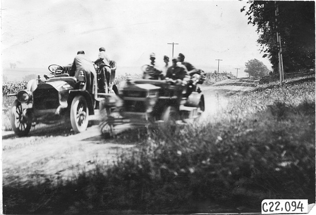Maxwell press car passes Studebaker on rural road near Manhattan, Kan., at 1909 Glidden Tour