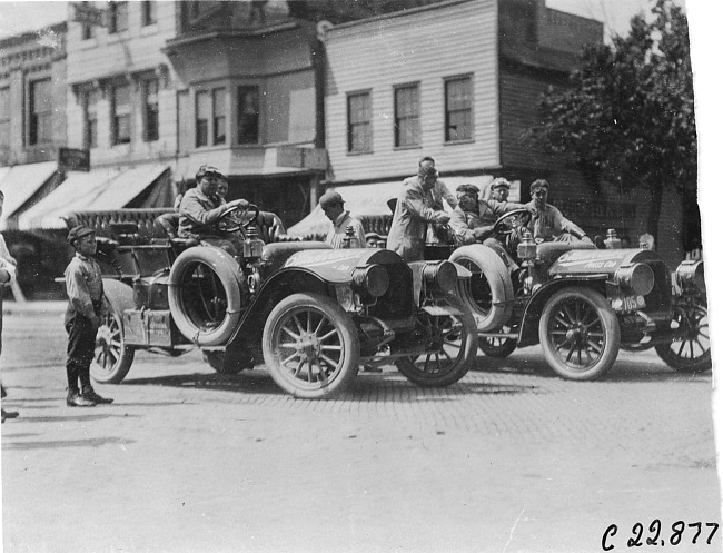 Studebaker cars on cobblestone street in Kansas City, Mo., at 1909 Glidden Tour