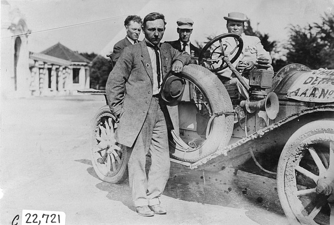 Jean Bemb posed next to Chalmers car at Kansas City, Mo., at 1909 Glidden Tour
