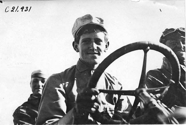 H.H. Porter posed in car at 1909 Glidden Tour