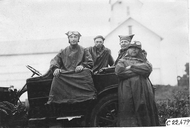 Crew of the Midland car in rain gear, at 1909 Glidden Tour
