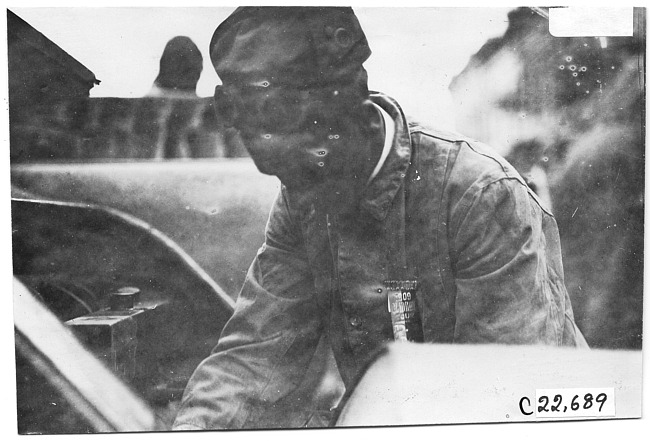 Teddy Day working on car, at 1909 Glidden Tour