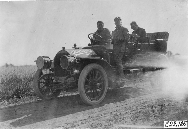 McIntosh in Studebaker car on rural road, at 1909 Glidden Tour