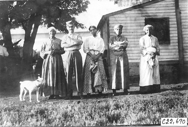 Glidden tourists pose with three women and dog, at 1909 Glidden Tour