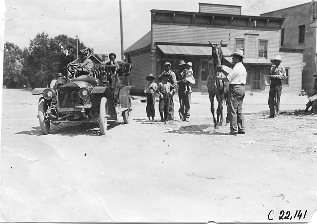 Studebaker car in rural town, at the 1909 Glidden Tour