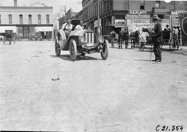 Jewel car #111 on downtown street, at the 1909 Glidden Tour