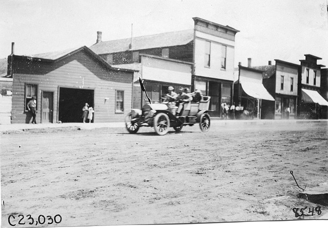 Glidden participants in rural town, at the 1909 Glidden Tour