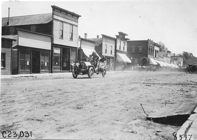 Glidden participants in rural town, at the 1909 Glidden Tour