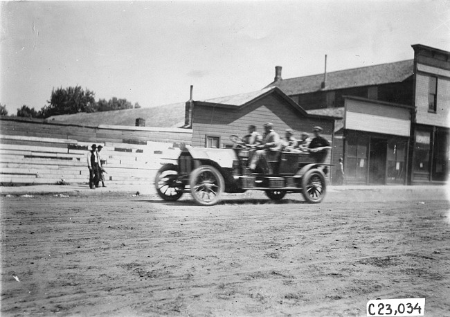 Glidden participants in rural town, at the 1909 Glidden Tour