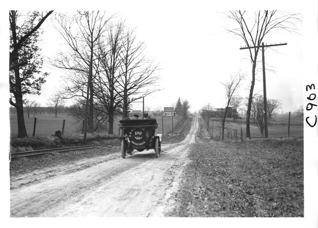 E.M.F. car on rural road, on pathfinder tour for the 1909 Glidden Tour