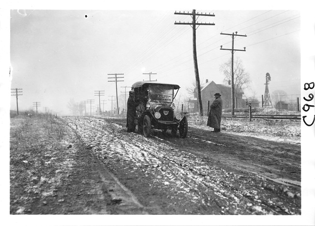 E.M.F. car on rural road in snow, on pathfinder tour for the 1909 Glidden Tour