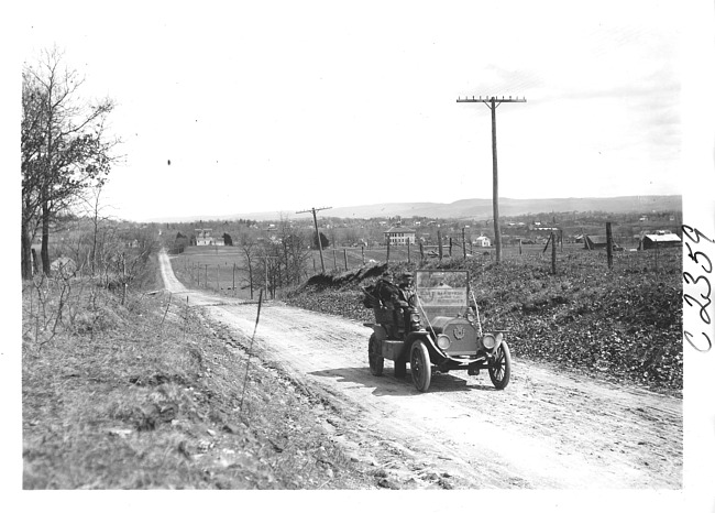 E.M.F. car in farming community, on pathfinder tour for 1909 Glidden Tour