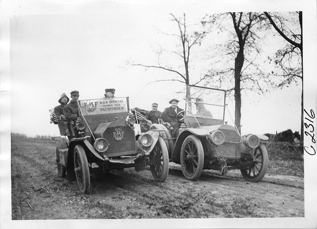 E.M.F. car on rural road next to another car, on pathfinder tour for 1909 Glidden Tour