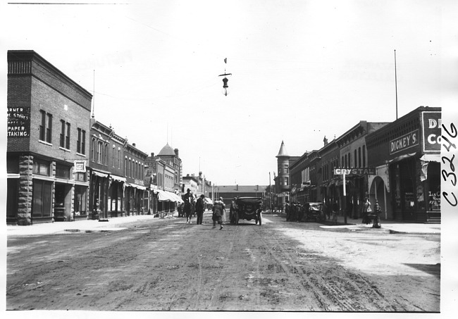 E.M.F. car in business district, on pathfinder tour for 1909 Glidden Tour