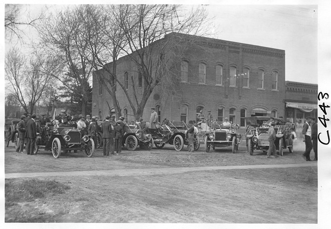 E.M.F. car in town with other cars, on pathfinder tour for 1909 Glidden Tour