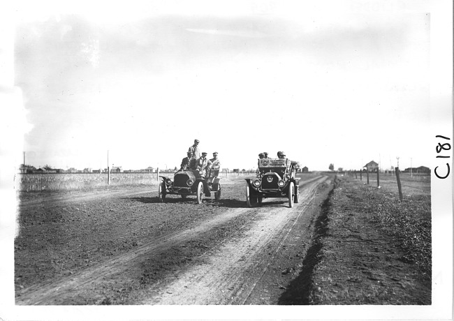 E.M.F. car passing another car on rural road, on pathfinder tour for 1909 Glidden Tour