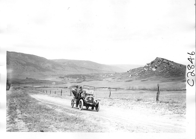 E.M.F. car on rural road near mountain, on pathfinder tour for 1909 Glidden Tour