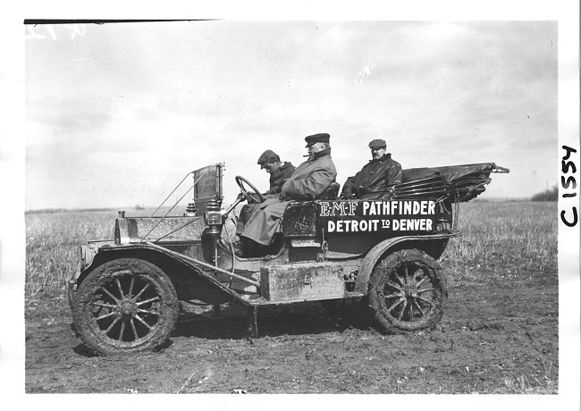 E.M.F. car on muddy rural road, on pathfinder tour for 1909 Glidden Tour