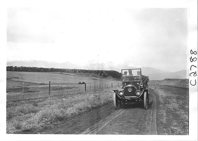 E.M.F. car on rural road near mountains, on pathfinder tour for 1909 Glidden Tour
