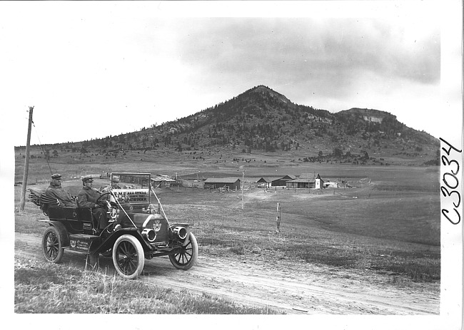 E.M.F. car on rural road near mountains, on pathfinder tour for 1909 Glidden Tour