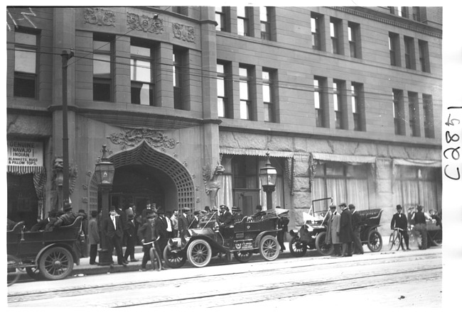 E.M.F. car in front of stone building, on pathfinder tour for 1909 Glidden Tour