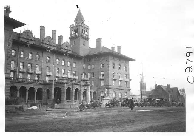 E.M.F. car by Antlers Hotel, Colorado Springs, Colo., on pathfinder tour for 1909 Glidden Tour