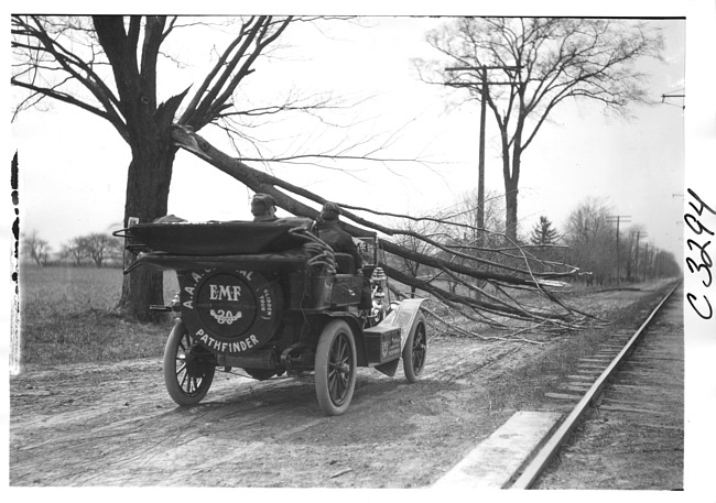 E.M.F. car blocked by fallen tree limb on road, on pathfinder tour for 1909 Glidden Tour