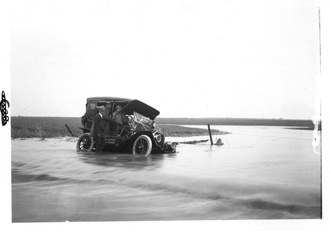 E.M.F. car stuck in water, on pathfinder tour for 1909 Glidden Tour