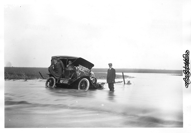 E.M.F. car stuck in water, on pathfinder tour for 1909 Glidden Tour