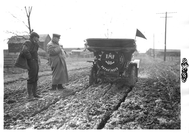 E.M.F. car on muddy road, on pathfinder tour for 1909 Glidden Tour